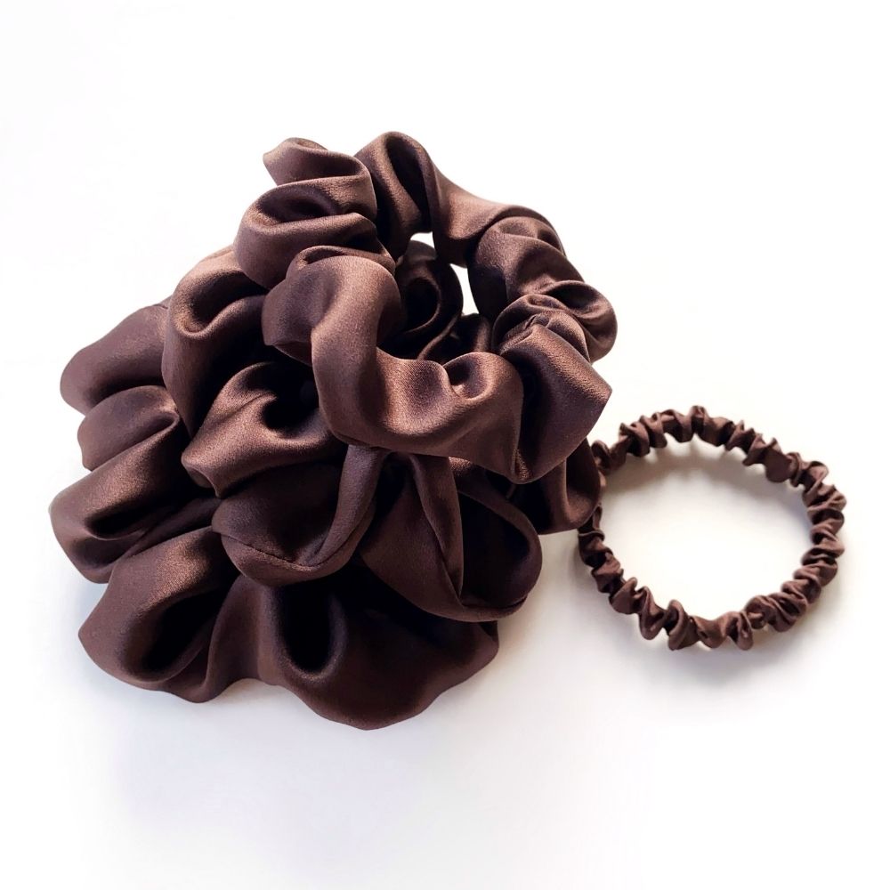 Brown mulberry silk satin scrunchies and silk hair ties and hair tie on a white background