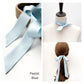 River Minami pastel blue mulberry silk satin ribbon scarf, styled as a neck scarf on a mannequin and as a hair accessory.