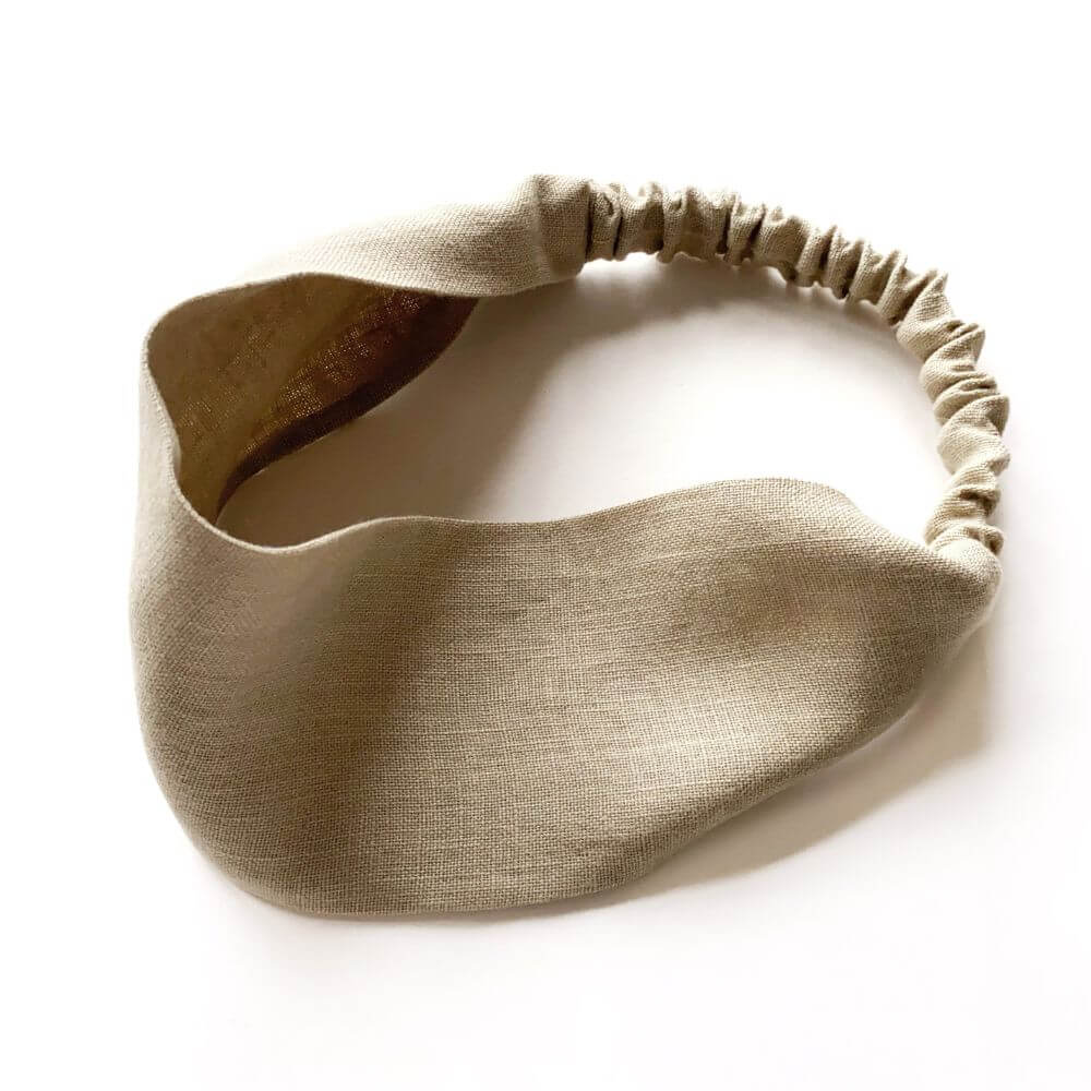 Beige headband on a white background
