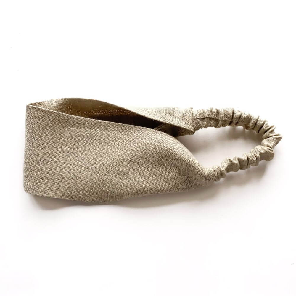 Beige headband on a white background