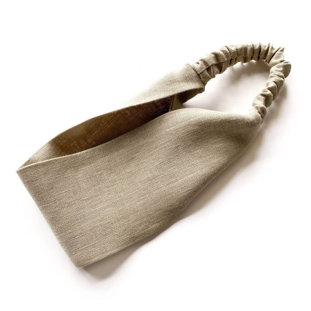 Beige headband on a white background