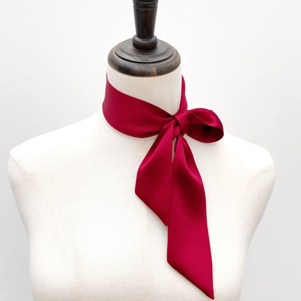 berry red mulberry silk satin skinny scarf tied around mannequin's neck