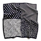 Black and white polka dot and paisley pattern mulberry silk square scarf laid flat on a white background.