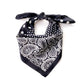 Black silk scarf with white paisley and polka dot pattern on a white background