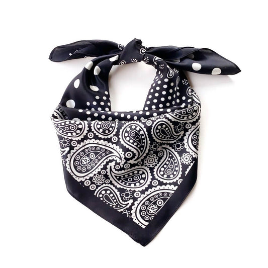 Black silk scarf with white paisley and polka dot pattern on a white background