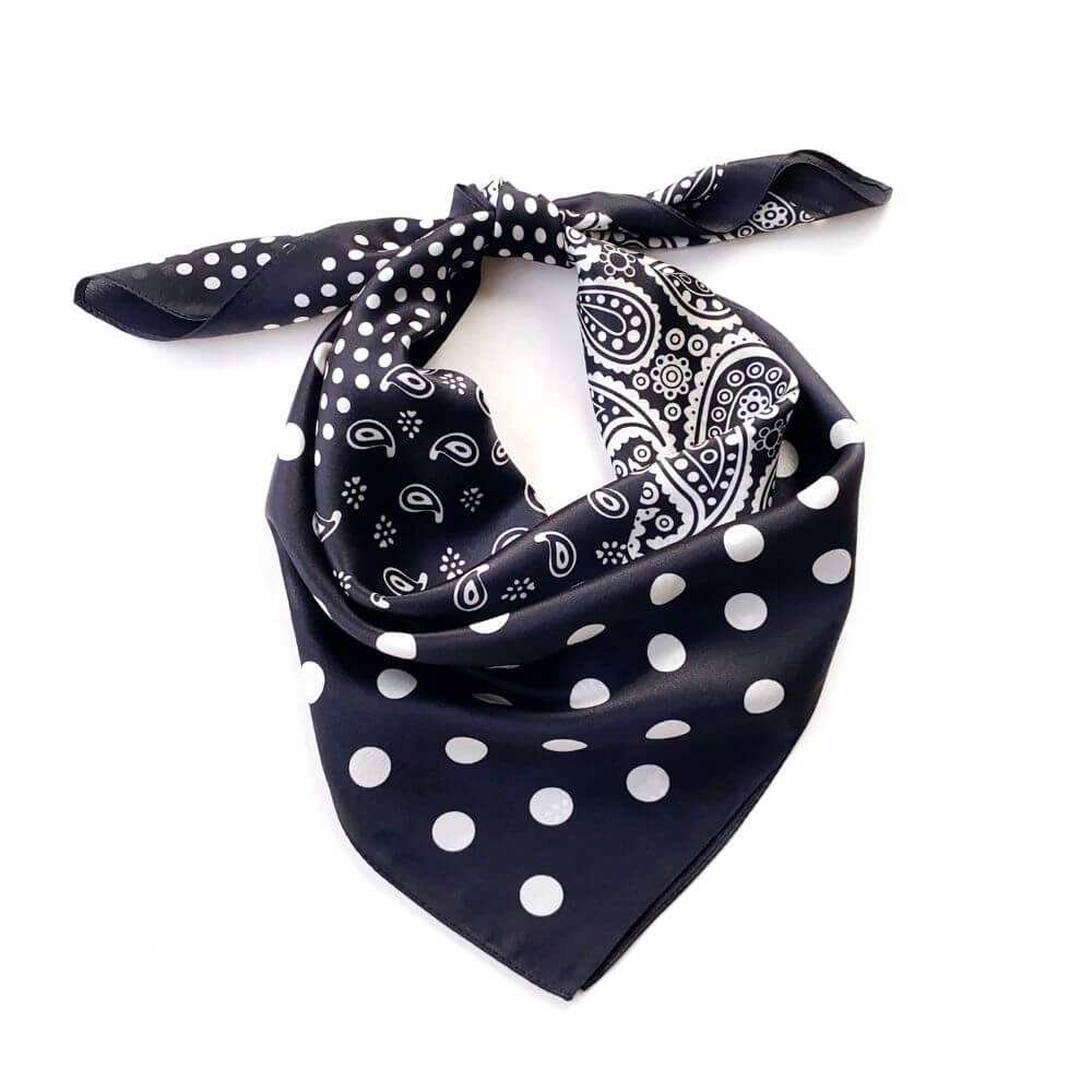 Black silk scarf with white paisley and polka dot pattern on a white background