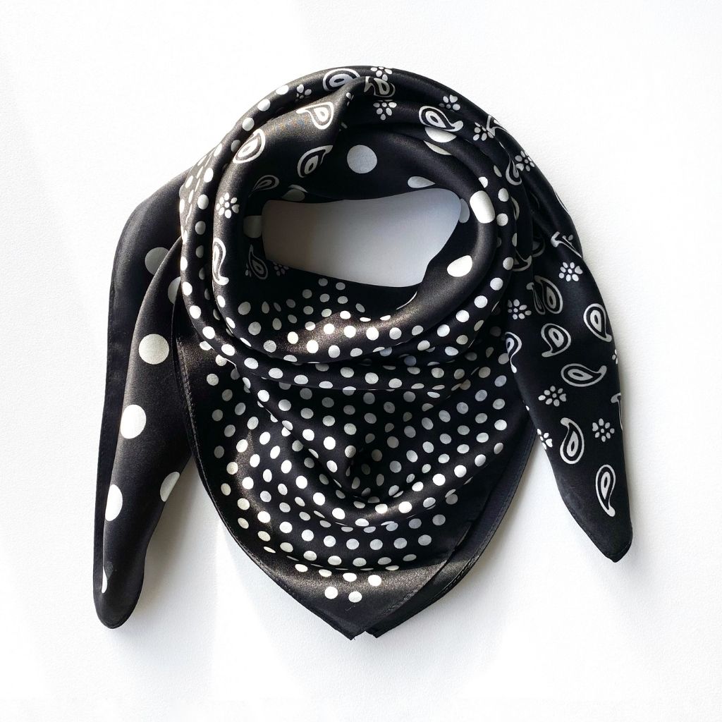 Black and white polka dot and paisley print mulberry silk square scarf displayed on a white background.
