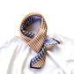 Blue & caramel geometric patterned mulberry silk neck scarf on a white t-shirt