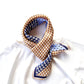Blue & caramel geometric patterned silk scarf on a white t-shirt