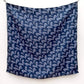 Blue paisley print mulberry silk square scarf hanging on a white wall
