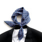 navy blue paisley patterned mulberry silk square neck scarf tied around a collar with a black suit and white t shirt