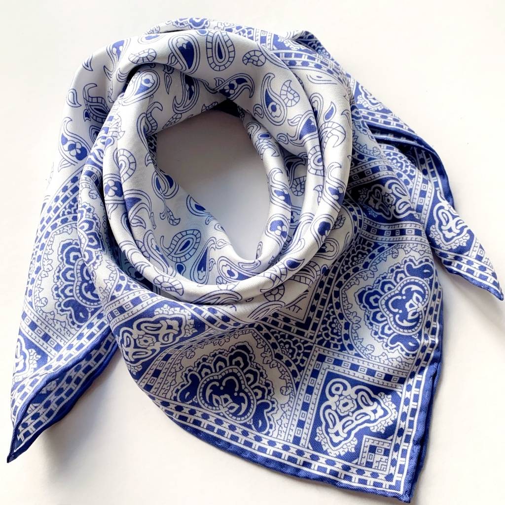 Blue and white geometric paisley pattern mulberry silk square scarf on a white background