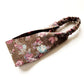 Brown rose floral patterned linen headband on a white background