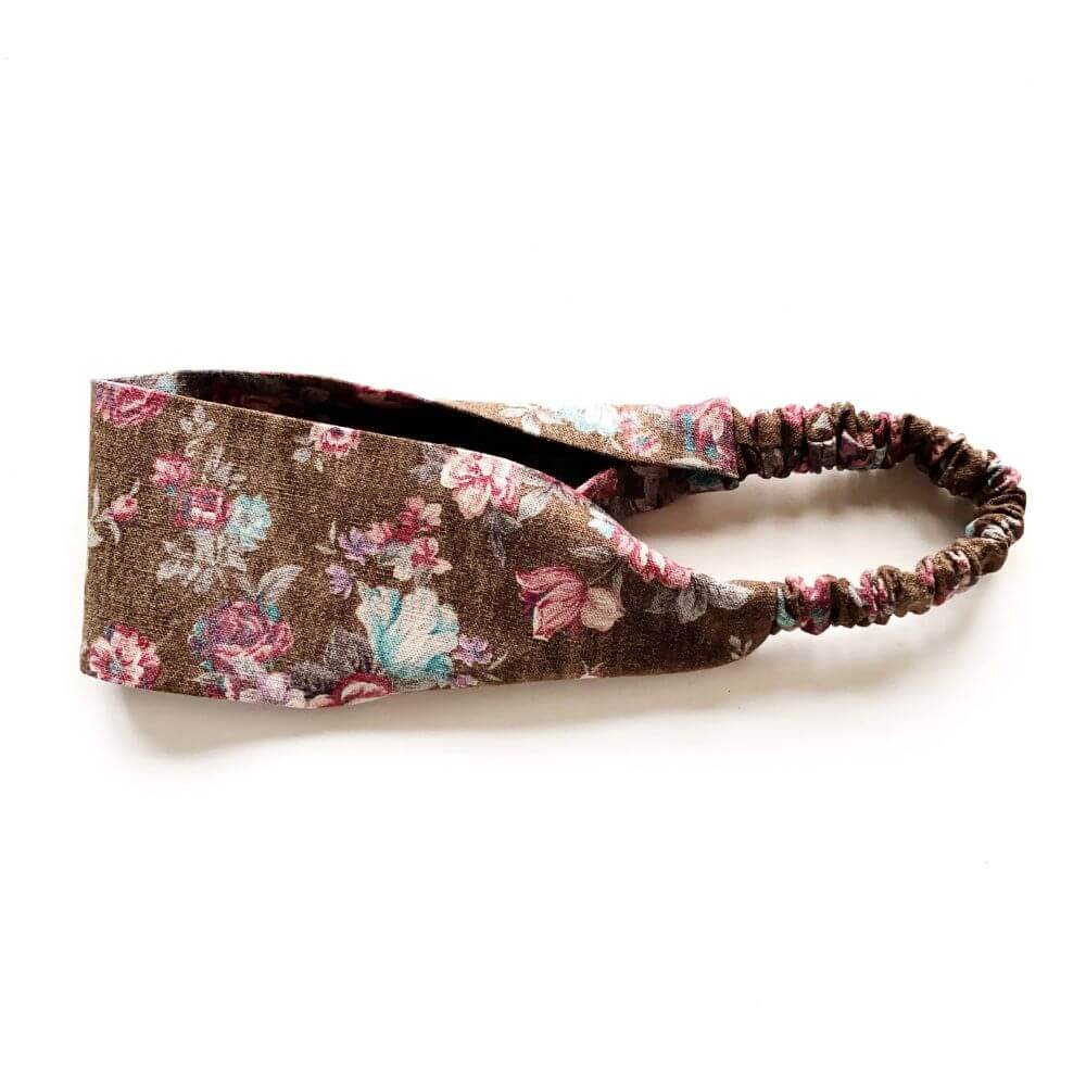 Brown rose floral patterned linen headband on a white background