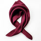 Maroon silk scarf on a white background