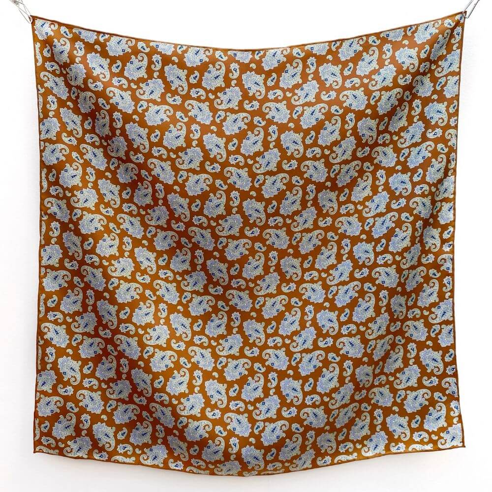 caramel orange brown mulberry silk square bandana scarf  with paisley  pattern on a white background