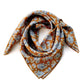 Caramel orange brown paisley patterned mulberry silk square bandana scarf on a white background