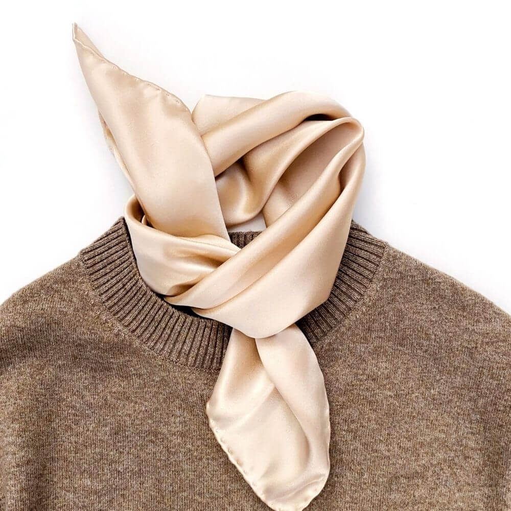 Champagne beige silk neckerchief styled on taupe knit jumper