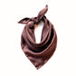 A hand rolled hem chocolate brown mulberry silk square scarf tied in a knot, displayed against a solid white background.