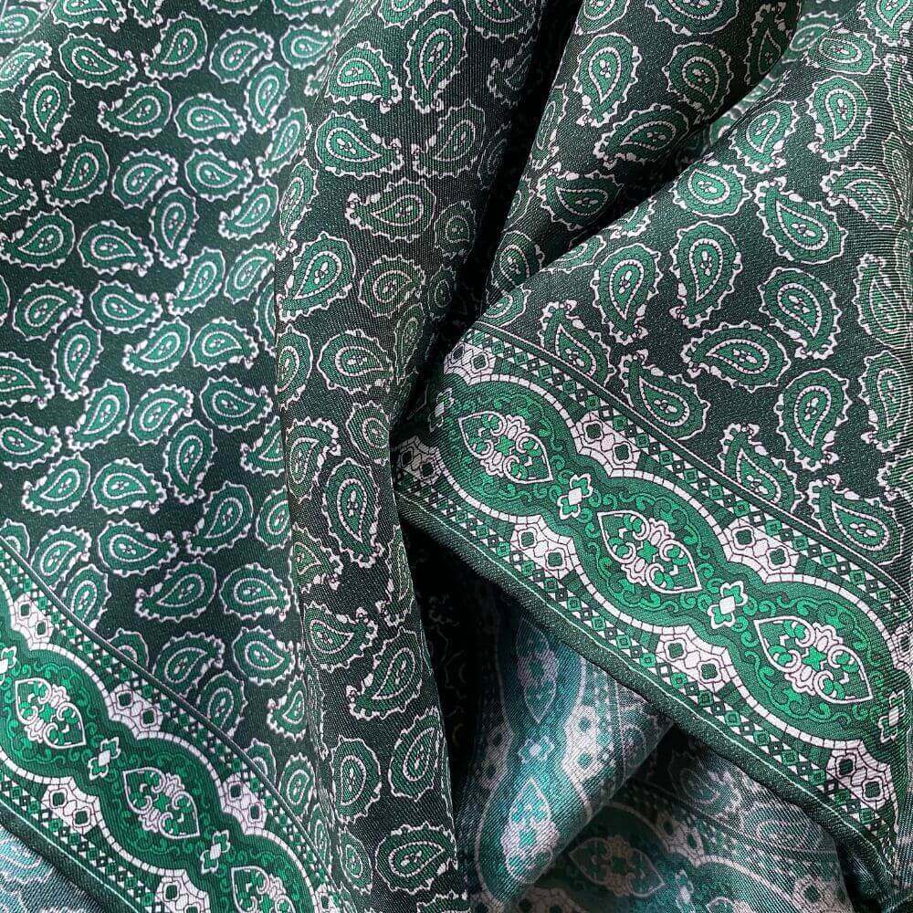 Close-up of green and white paisley print mulberry silk square scarf