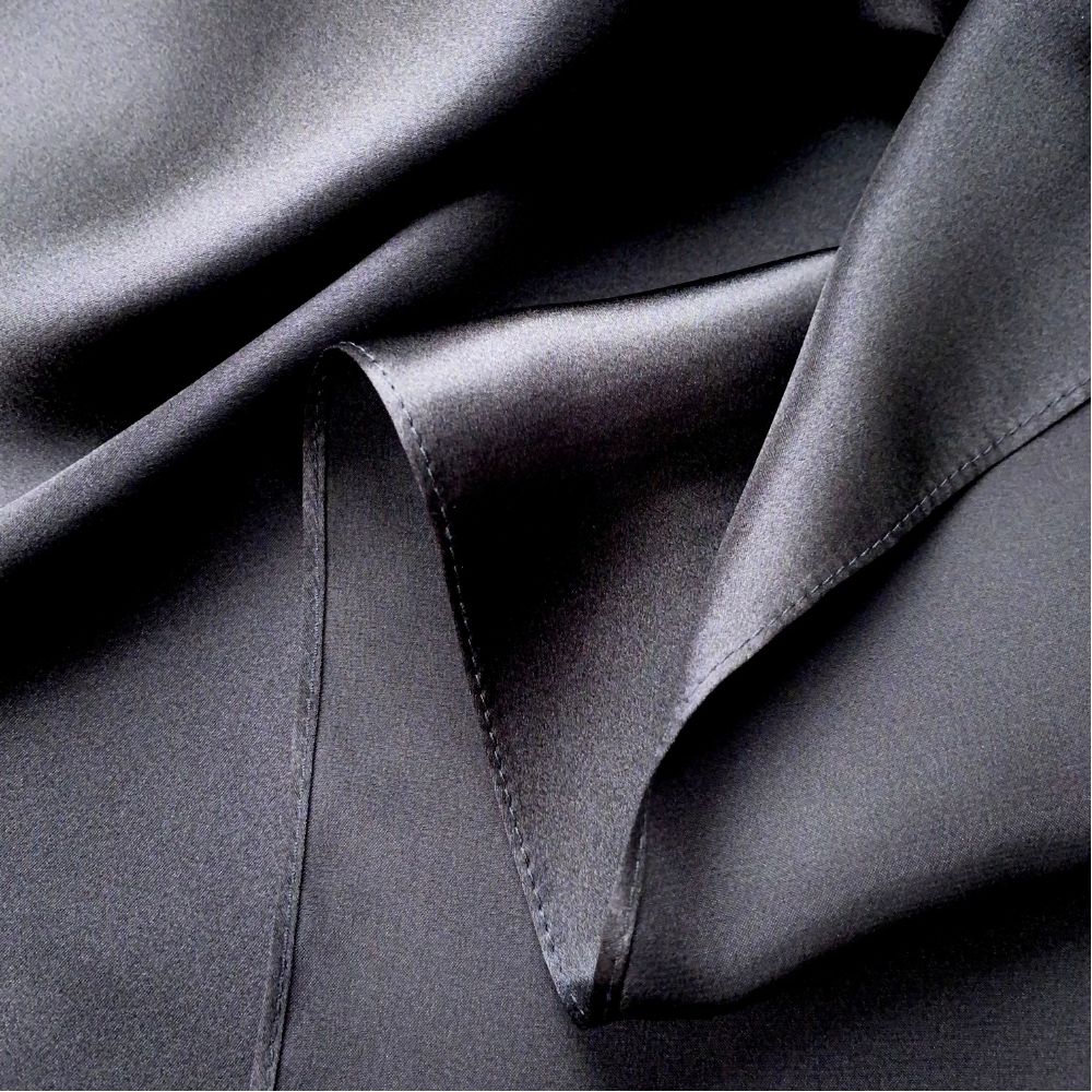 close up of a black mulberry silk square scarf 