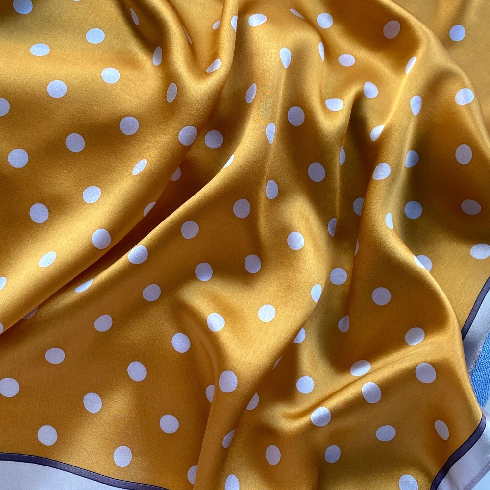 close-up of a mustard Yellow mulberry silk square scarf with beige cream polka dots print