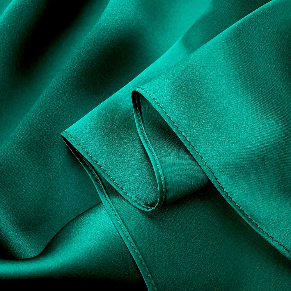 closed up of a solid emerald green mulberry silk square scarf