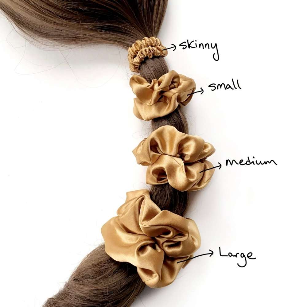 copper brown mulberry silk scrunchies hair ties of different sizes on a ponytail with labeled sizes.
