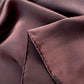 Close-up of brown silk scarf with a hand rolled hem 