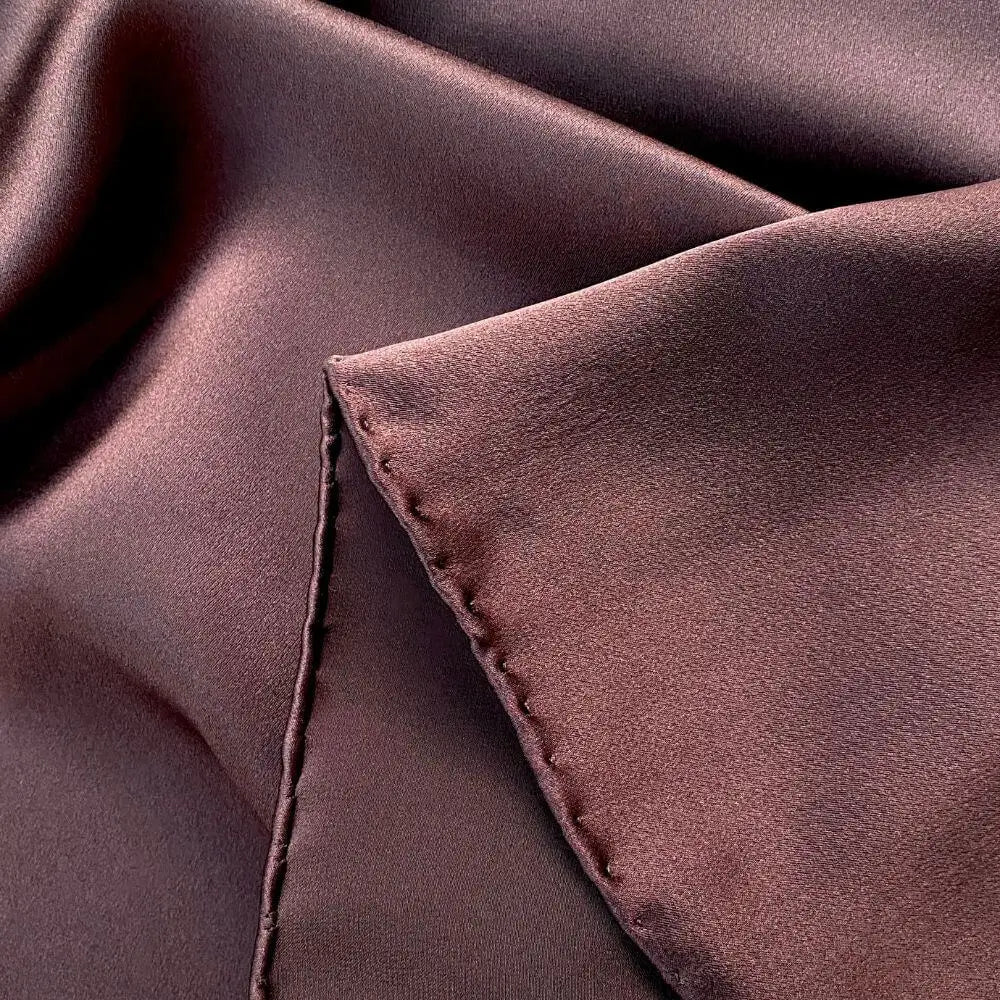 Close-up of brown silk scarf with a hand rolled hem 