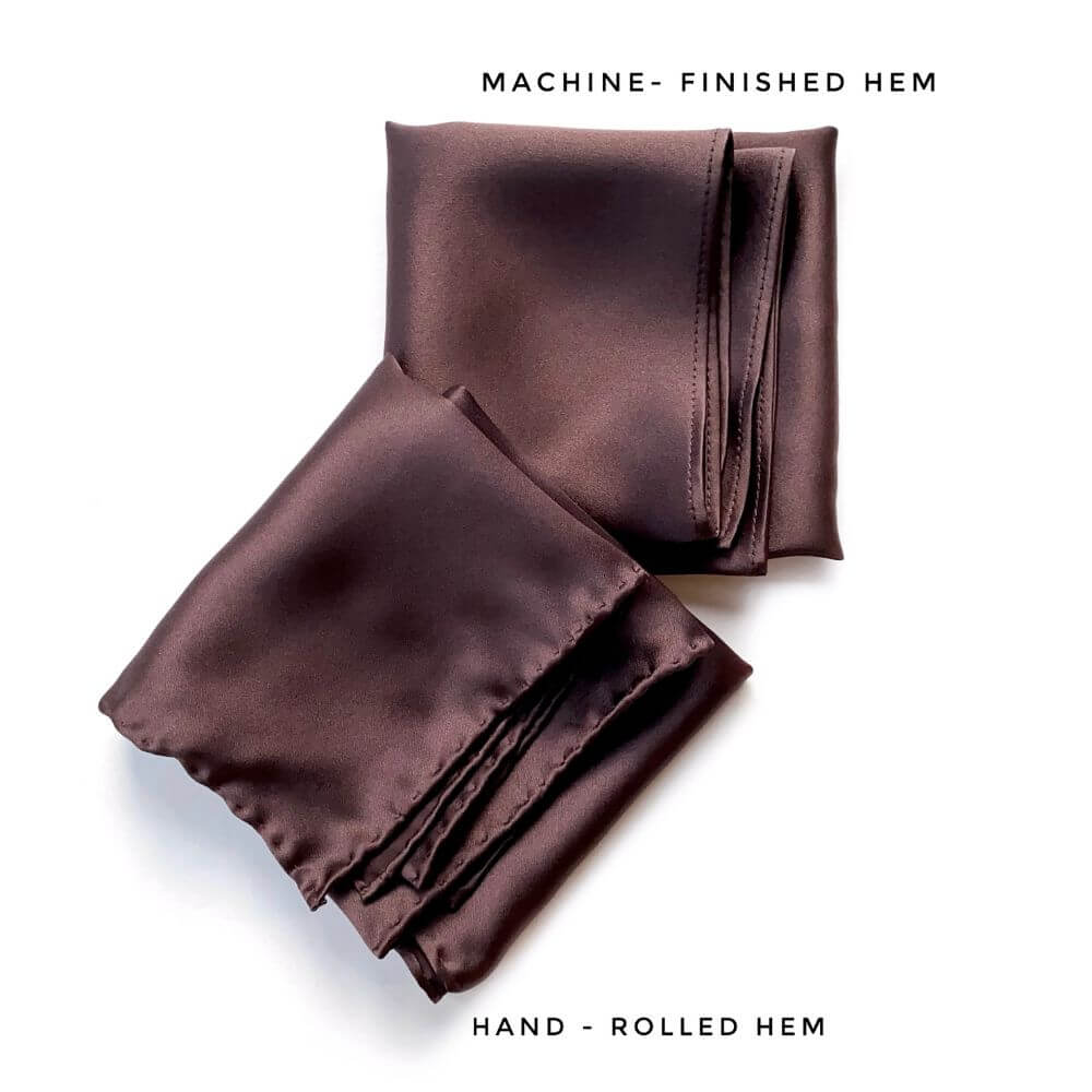 Two folded brown silk scarves with text indicating machine-finished and hand-rolled hem options on a white background.