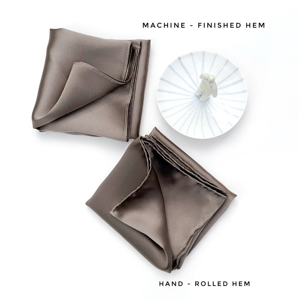 Machine-finished and hand-rolled hems compared in dark taupe silk