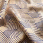 Dusty rose pink mulberry silk scarf with a navy blue geometric line pattern, shown in soft folds.