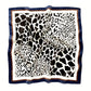 mulberry silk square scarf with black leopard print pattern on a ivory background, framed with blue and brown boarder.