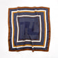 Navy blue and brown geometric print mulberry silk square scarf on a white background