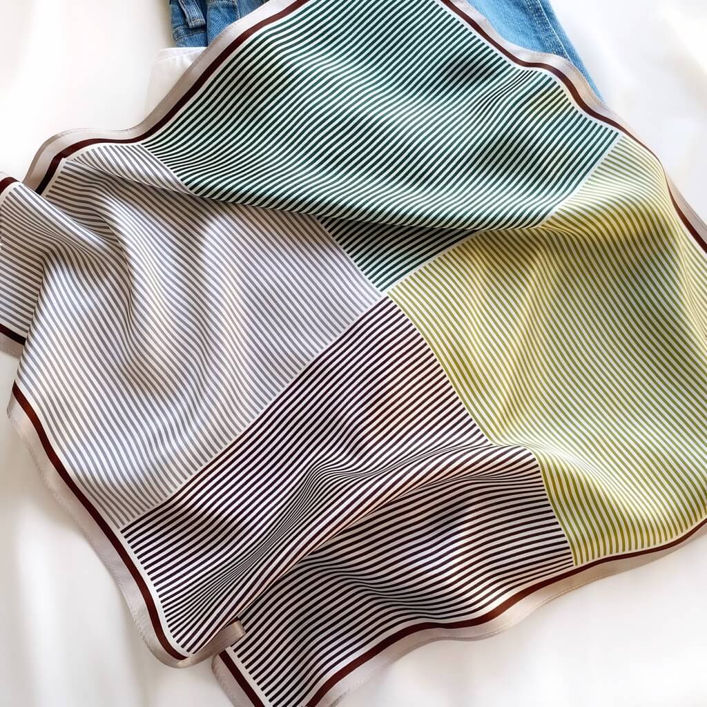 green grey geometric stripe print mulberry silk square scarf on a white background