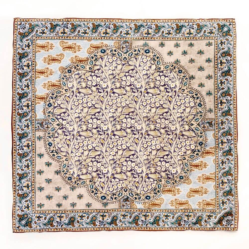 Full flat lay of the yellow and teal paisley floral mulberry silk and cotton blend bandana square scarf showing the central and border motifs.