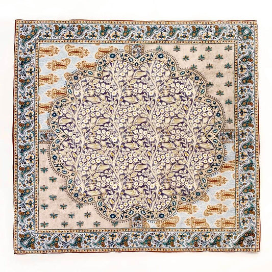 Full flat lay of the yellow and teal paisley floral mulberry silk and cotton blend bandana square scarf showing the central and border motifs.