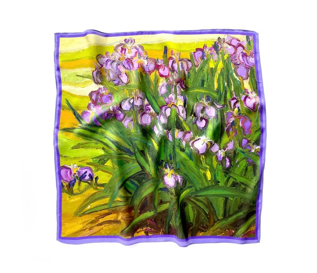 Mulberry silk square scarf with a floral design featuring purple iris flowers and green leaves on a yellow background.
