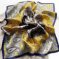 flat displayed mulberry silk square scarf with paisley print in yellow, grey and silver