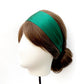 Model wearing a luxury emerald green mulberry silk headband by River Minami.
