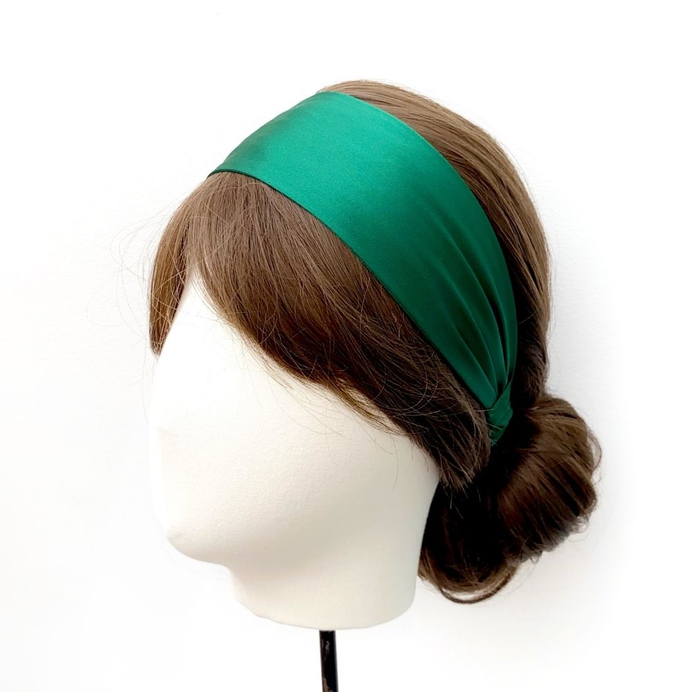 Model wearing a luxury emerald green mulberry silk headband by River Minami.