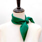 A forest green mulberry silk square scarf tied in a knot on mannequin neck, set against a plain white background.