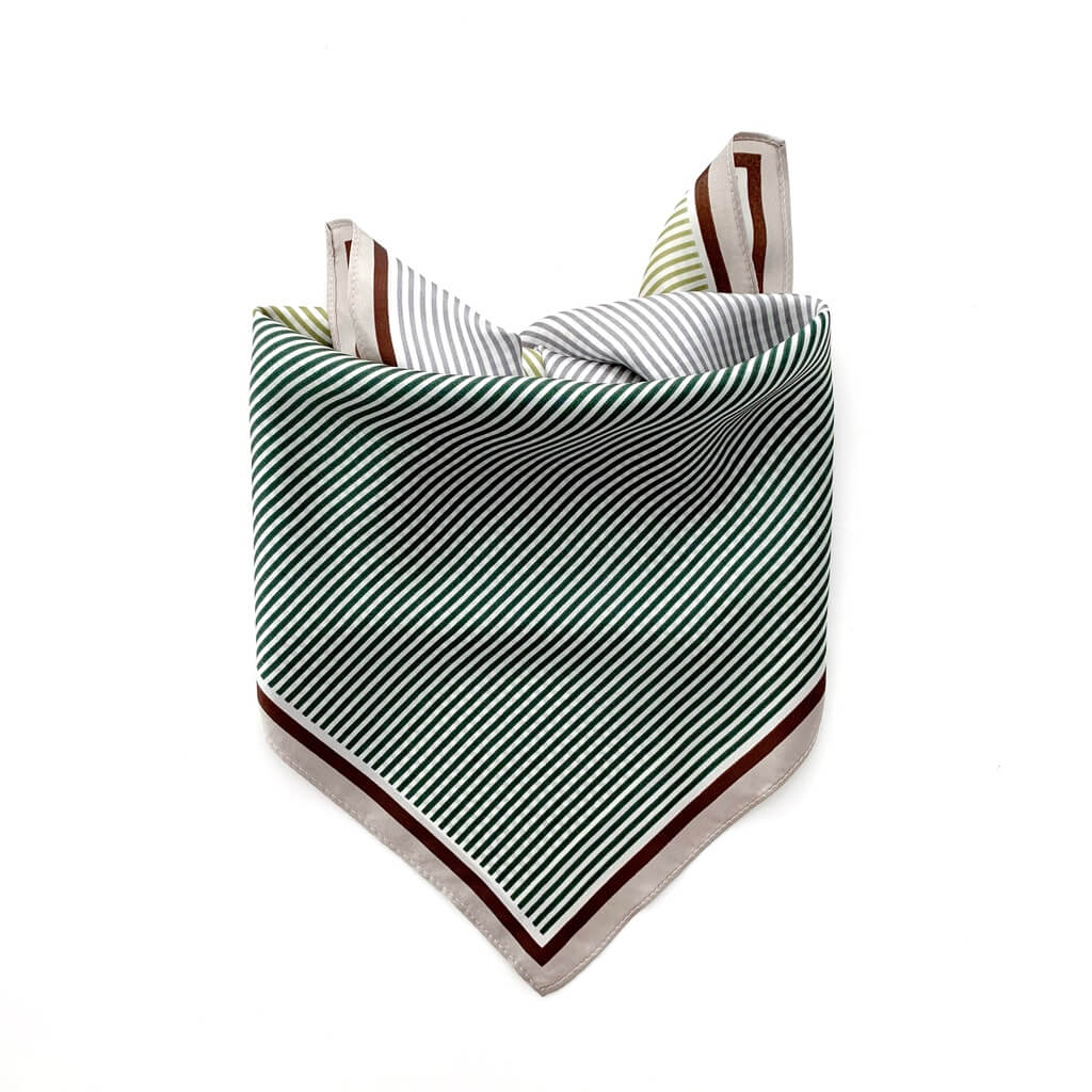 Geometric striped mulberry silk square scarf with green and white lines pattern on a white background