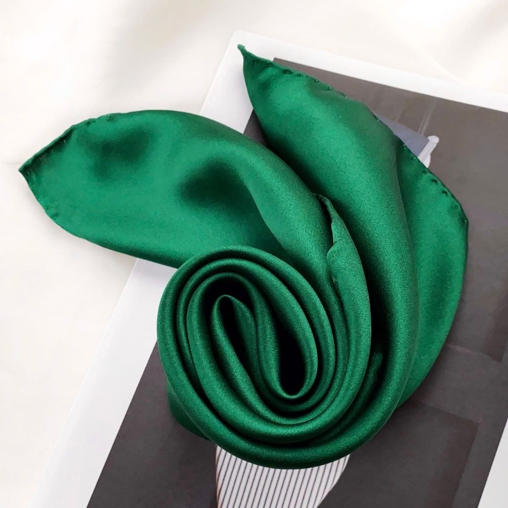 Jade Green silk satin scarf styled on a magazine with soft sheen
