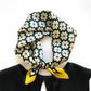 Floral patterned mulberry silk neckerchief with yellow accents on a white background