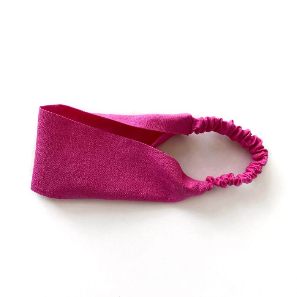 hot pink linen headband on a white background