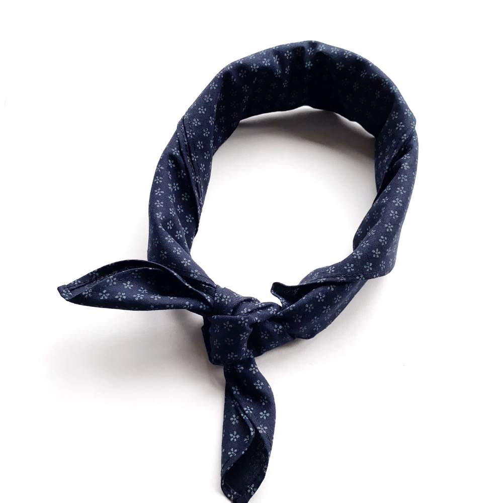 Navy blue floral patterned bandana on a white background