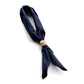 Navy blue patterned scarf with a tan leather buckle on a white background