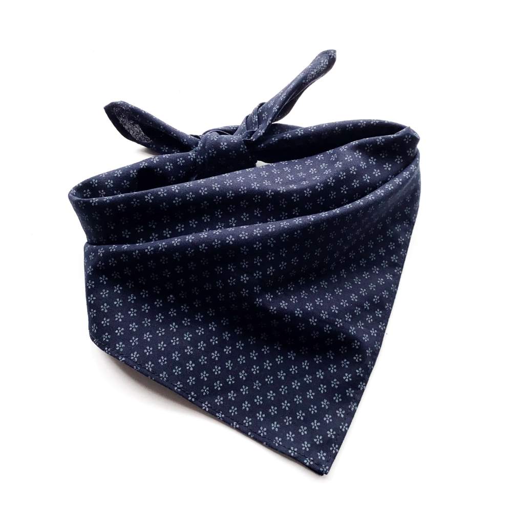 Navy blue bandana with white floral pattern on a white background